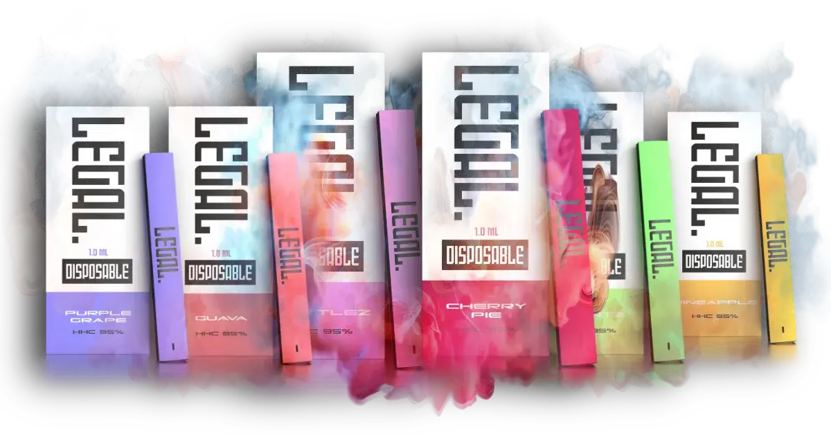 Assorted flavoured disposable vape pens with smoke.